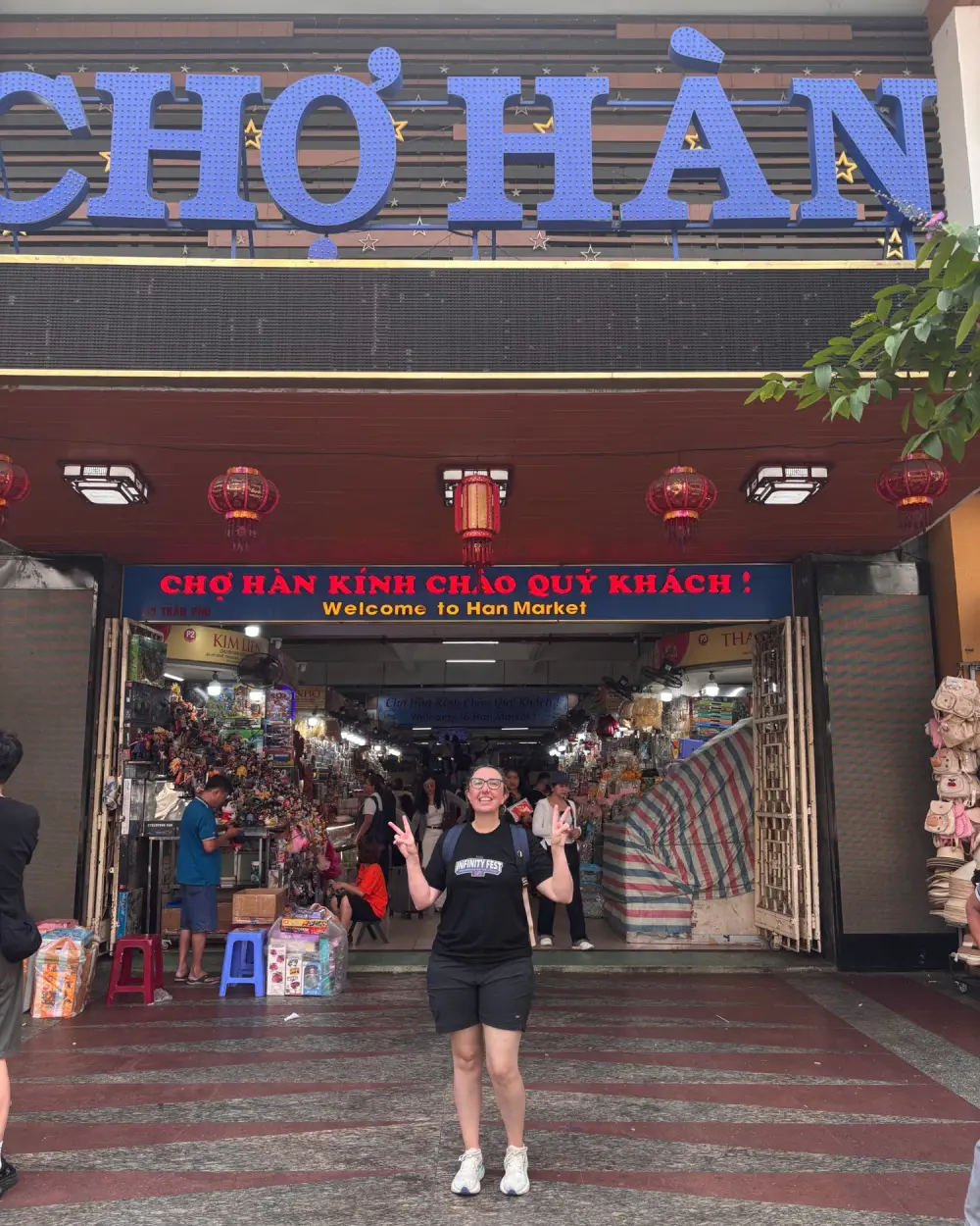 A guest at the entrance of Han Market in Da Nang