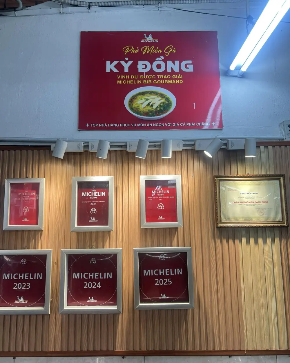 Michelin Bib Gourmand plaques at Phở Miến Gà Kỳ Đồng in Saigon